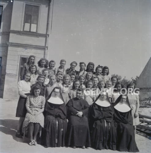 Students of an all girls' school and staff (priest and nuns).