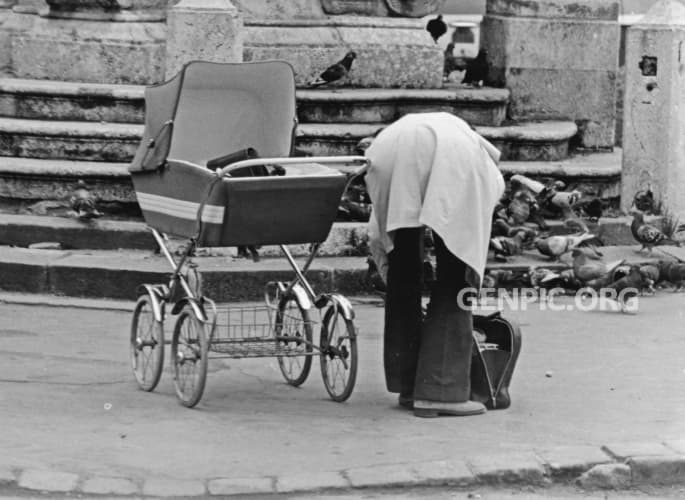 Mom with a stroller.