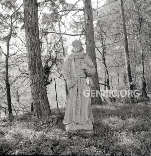 Stone monks near the St. Wendelin's Chapel with tomb of Pallfy family.